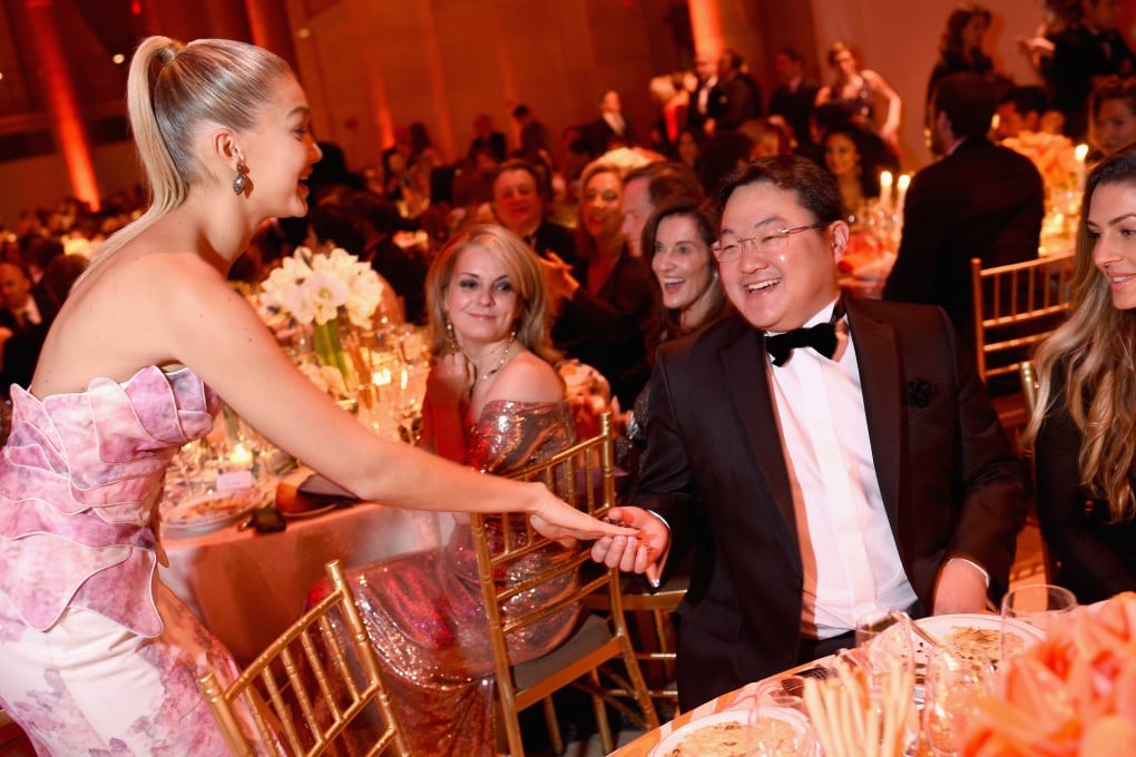American fashion model Gigi Hadid and Jho Low (centre) attend an event in New York City in 2014. Photo: Getty Images for Gabrielle’s Angel Foundation/AFP