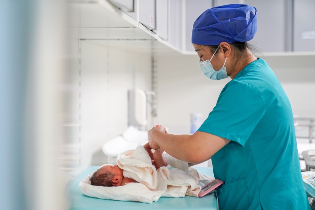 A nurse cares for a neonatal patient at the First People’s Hospital of Yunnan Province in Kunming on Sunday. Photo: Xinhua