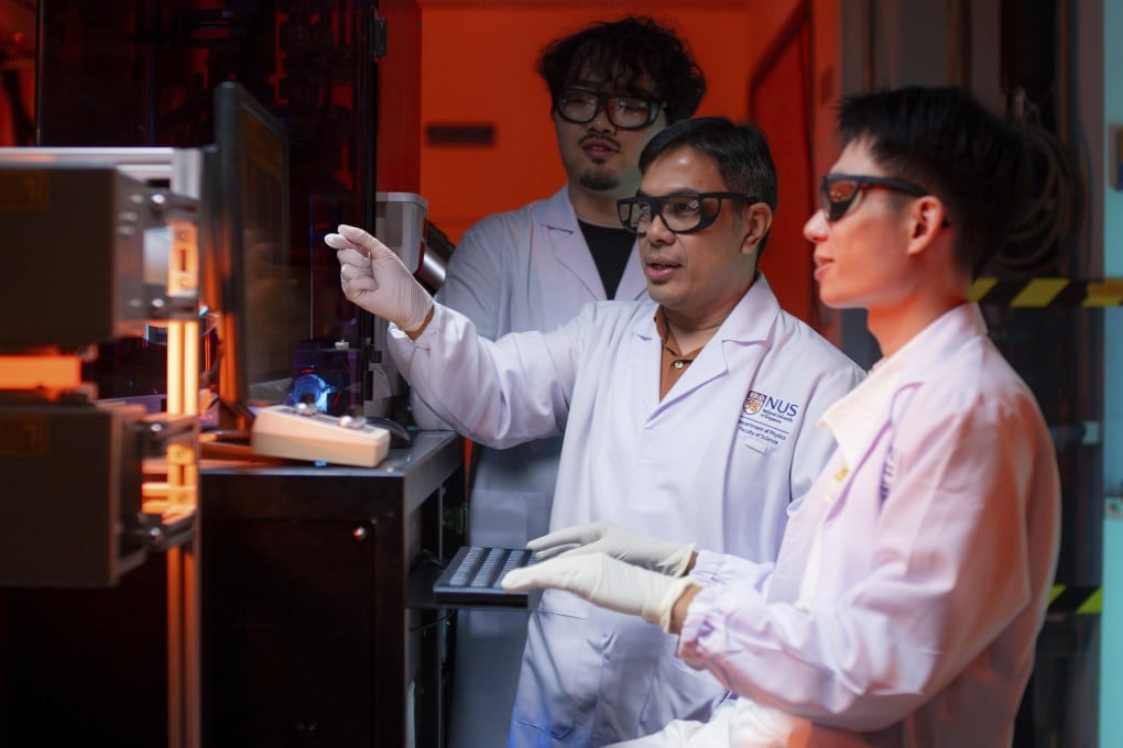Stephen Lin Er Chow (right), pictured with colleagues from the research team that designed the new copper-free superconducting material. Photo: NUS Faculty of Science