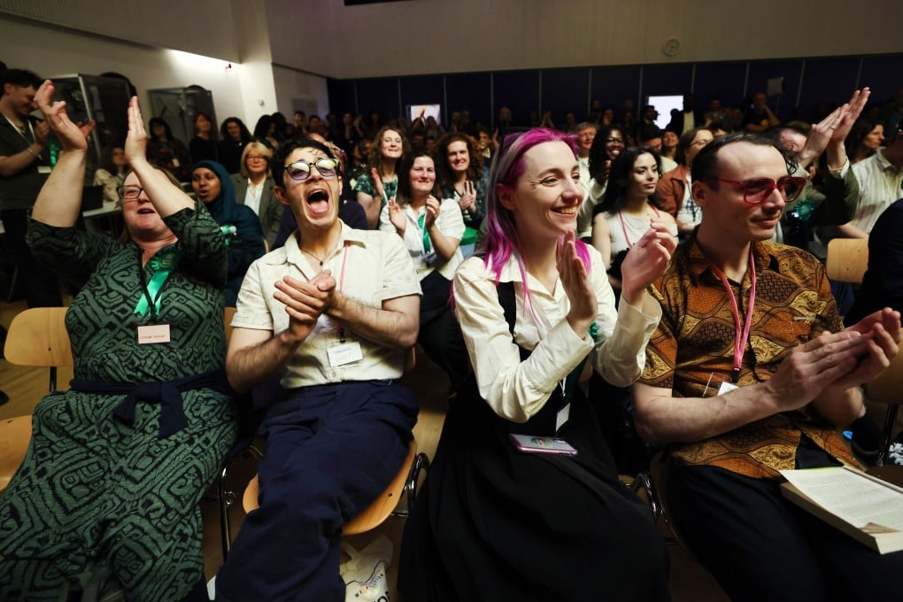 Members of the Green Party celebrate a win in Bellingham in south London on May 9. Photo: EPA