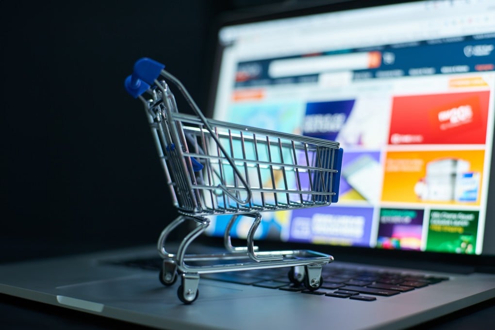 Small shopping cart on a laptop keyboard signifies convenience in digital purchases. Photo: Shutterstock Images
