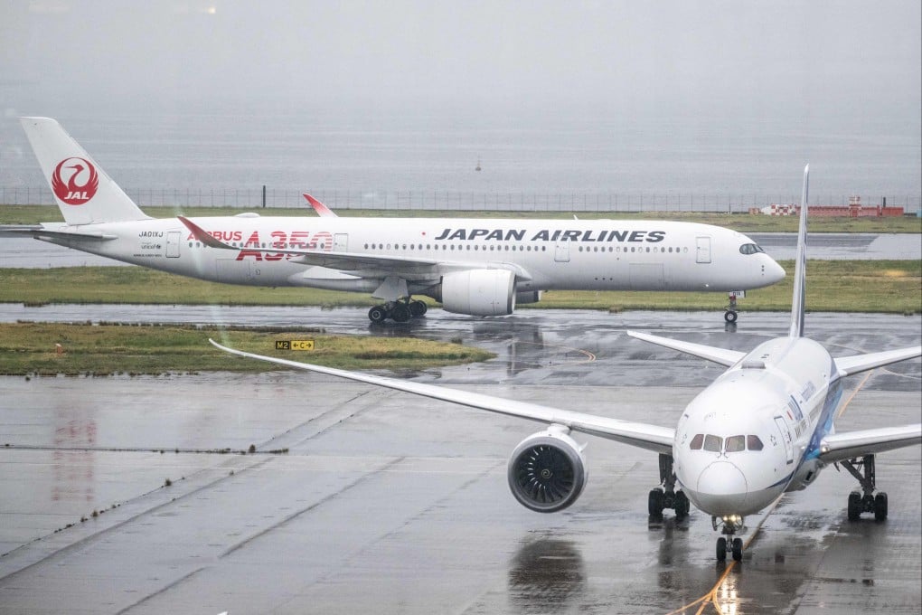A Japan Airlines Airbus A350-900 and an All Nippon Airways Boeing 787 at Tokyo’s Haneda Airport on April 23. Photo: AFP