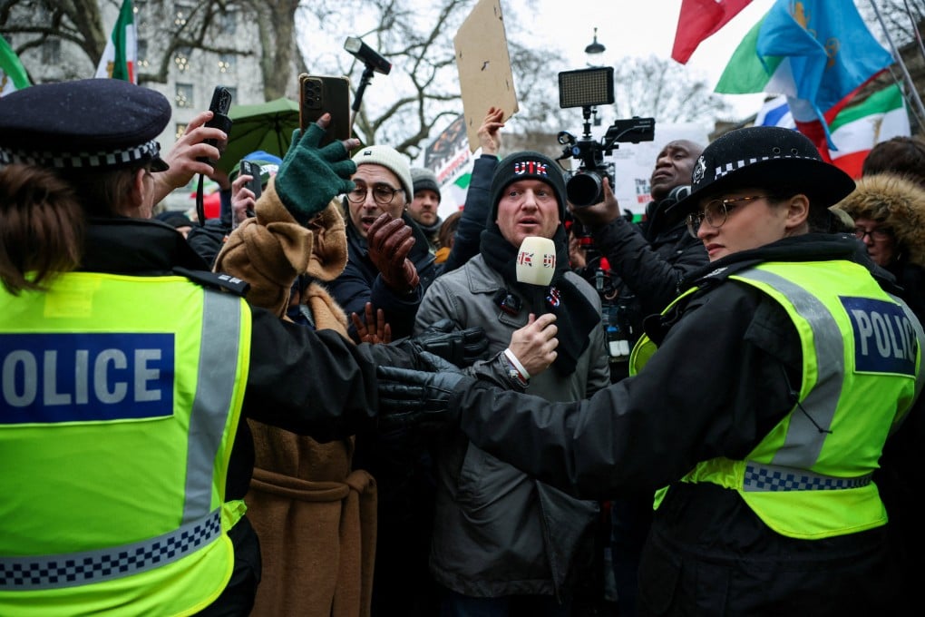 Far-right activist Stephen Yaxley-Lennon, known as Tommy Robinson, wears a ‘Unite The Kingdom’ (UTK) hat and scarf at a protest on January 11. Photo: Reuters