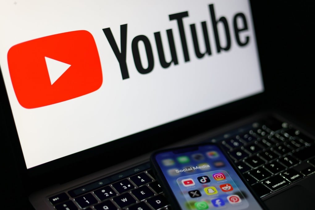 A YouTube logo is displayed on a laptop. Photo: EPA