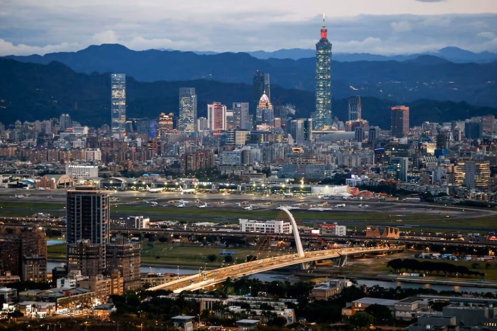 Taipei’s skyline, including the Taipei 101 skyscraper, rises beyond Songshan Airport. Photo: Reuters