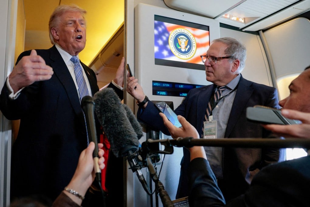 US President Donald Trump speaks to the press aboard Air Force One en route to the US following his official visit with President Xi Jinping in China on Friday. Photo: Reuters