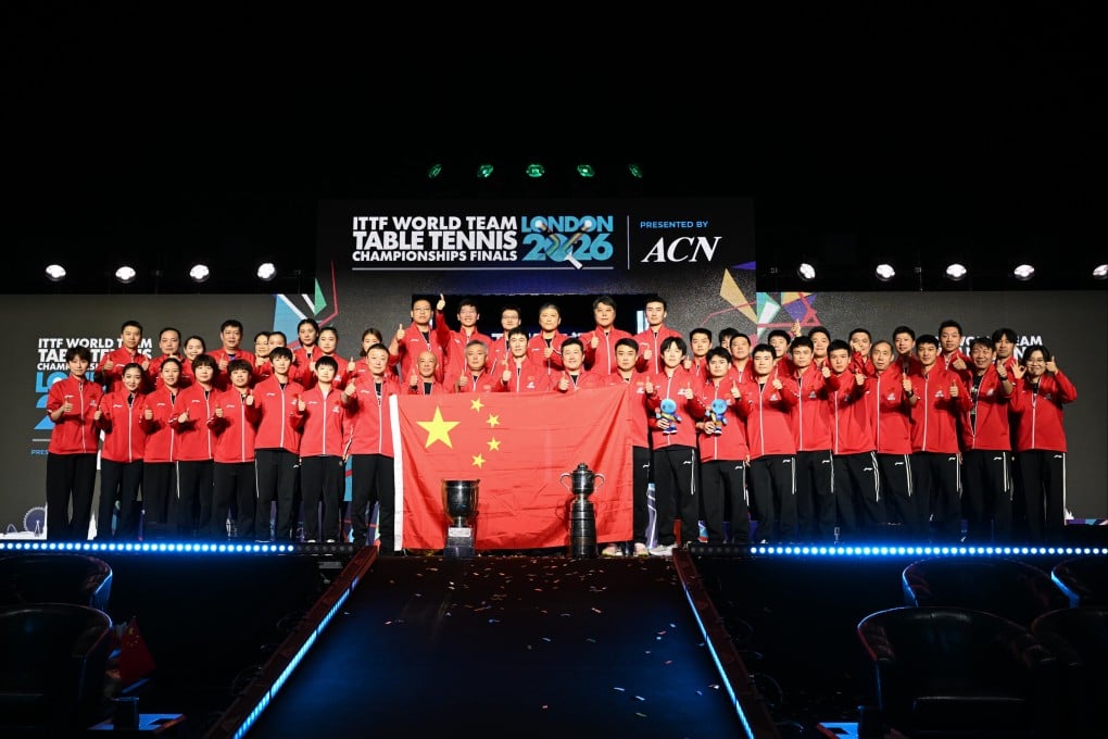 Members of the China men and women’s teams pose with their trophies after winning the ITTF World Team Table Tennis Championships. Photo: Xinhua