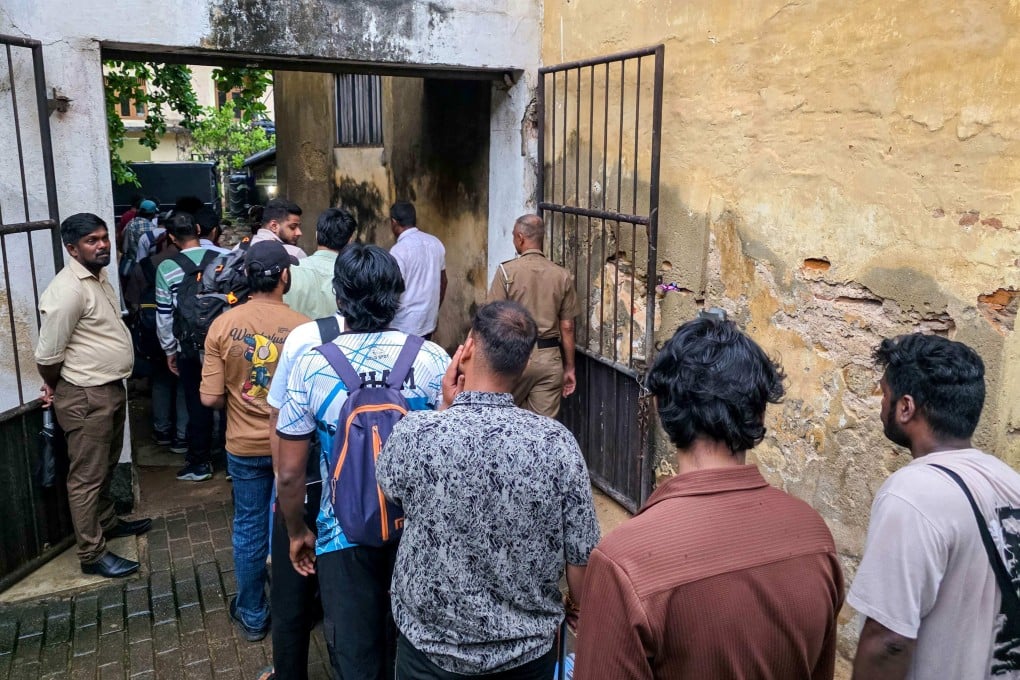 Police escort detained Indian and Nepalese nationals suspected of running cyber fraud centres to a court in Galle, Sri Lanka, on Tuesday. Photo: AFP