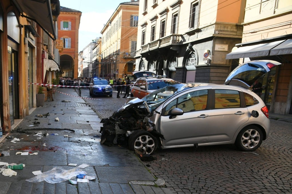 A damaged car is seen after an incident in Modena, Italy, on Saturday. Photo: Lapresse via AP