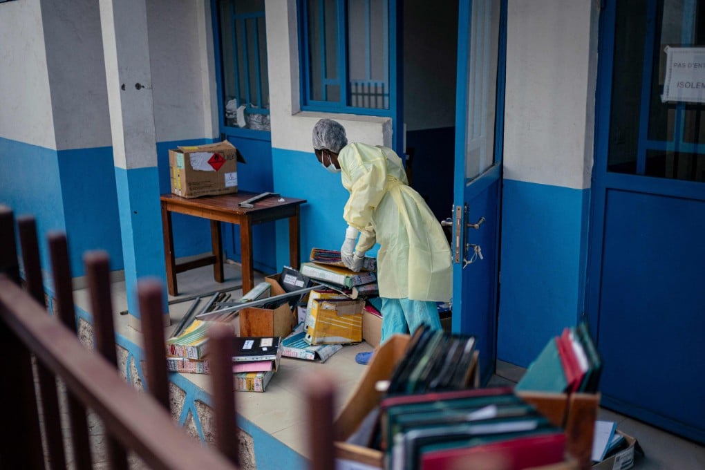 A staff member at CBCA Virunga Hospital in Goma, Democratic Republic of Congo, prepares rooms intended for possible suspected Ebola cases. Photo: AFP