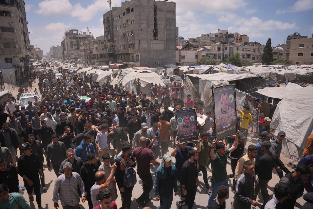 The funeral for Ezzedine al-Haddad, his daughter and wife in Gaza City on Saturday. They were killed in an Israeli strike Friday evening. Photo: AP