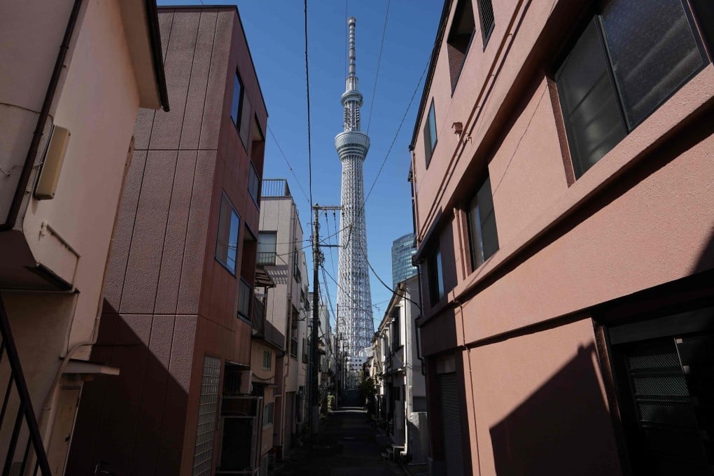 Tokyo Skytree is pictured between residential buildings on February 20, 2025. Photo: AFP