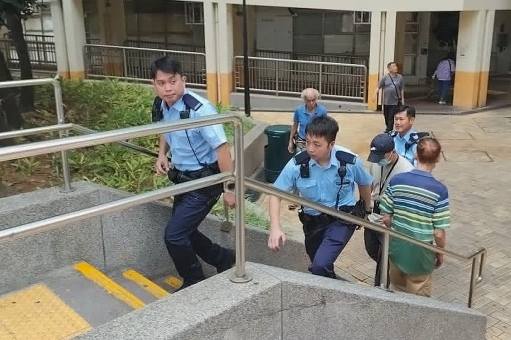 Policemen arrive at Fu Cheong Estate in Sham Shui Po, where a chronically ill woman was found dead inside a flat she shared with her mentally ill daughter. Photo: Handout