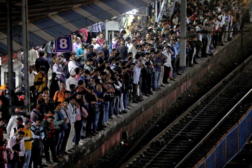 Commuters crowd on a train platform in Mumbai. The UN projects India’s population will keep rising for ‌about four decades, peaking at around 1.7 billion. Photo: Reuters