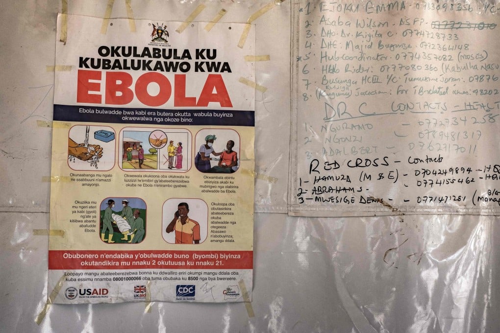 A poster displaying Ebola emergency contact numbers at a border crossing between Uganda and the Democratic Republic of Congo in Bundibugyo. Photo: AFP