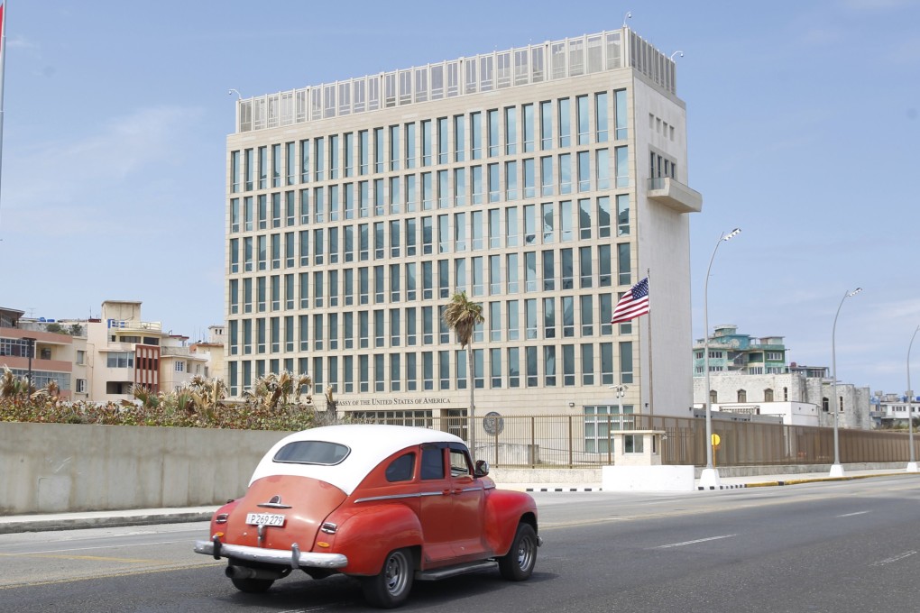 An old car drives past the US embassy in Havana, Cuba, as geopolitical tensions flare between the two nations. Photo: EPA