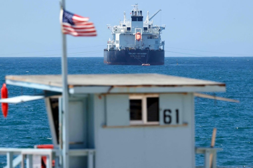 An American flag flies in front of the Texas Voyager oil and chemical tanker, anchored in the Pacific Ocean off the coast of the Chevron El Segundo refinery, on April 23. Photo: AFP