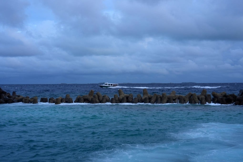 A speedboat moves in the waters of the Indian Ocean on Monday near where a team located the bodies of four Italian scuba divers who died while exploring underwater caves. Photo: Reuters