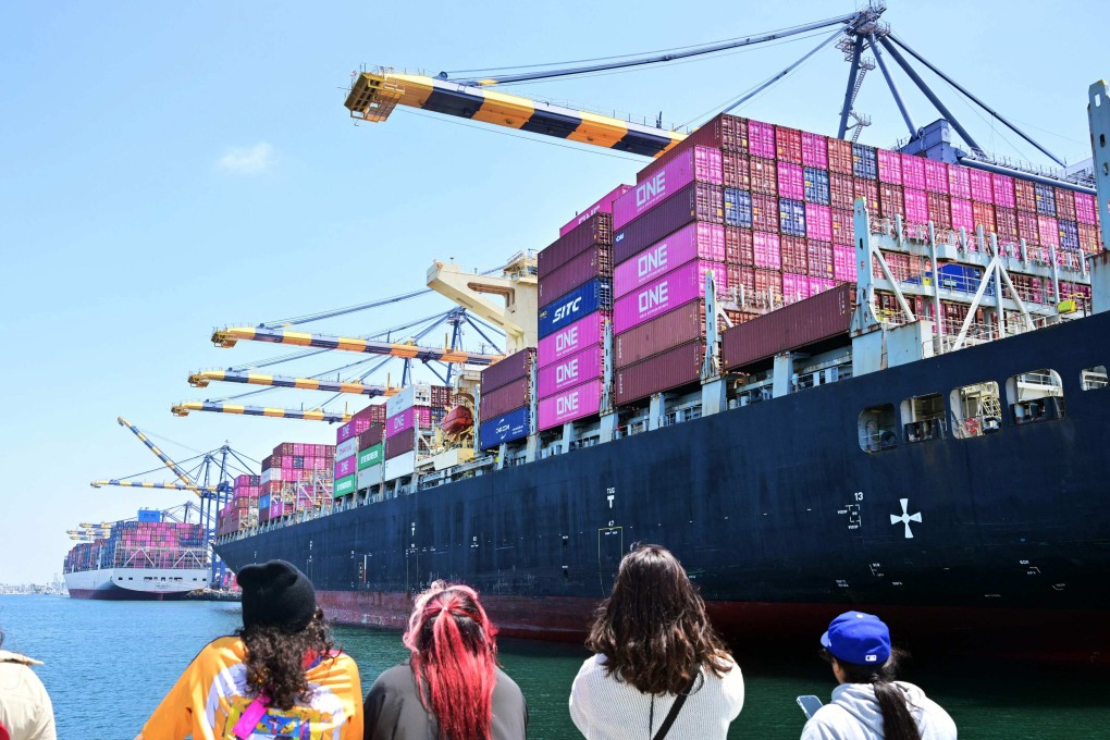 People watch freight ships full of containers at the Port of Los Angeles, California, on May 9. Photo: AFP