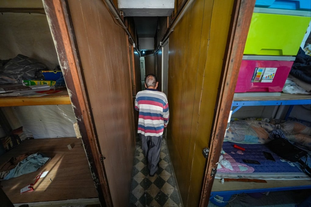 An elderly tenant in his subdivided flat at Yee Wa Building in Cheung Sha Wan. Housing authorities say 40 households that faced evictions last year are still living there. Photo: Eugene Lee