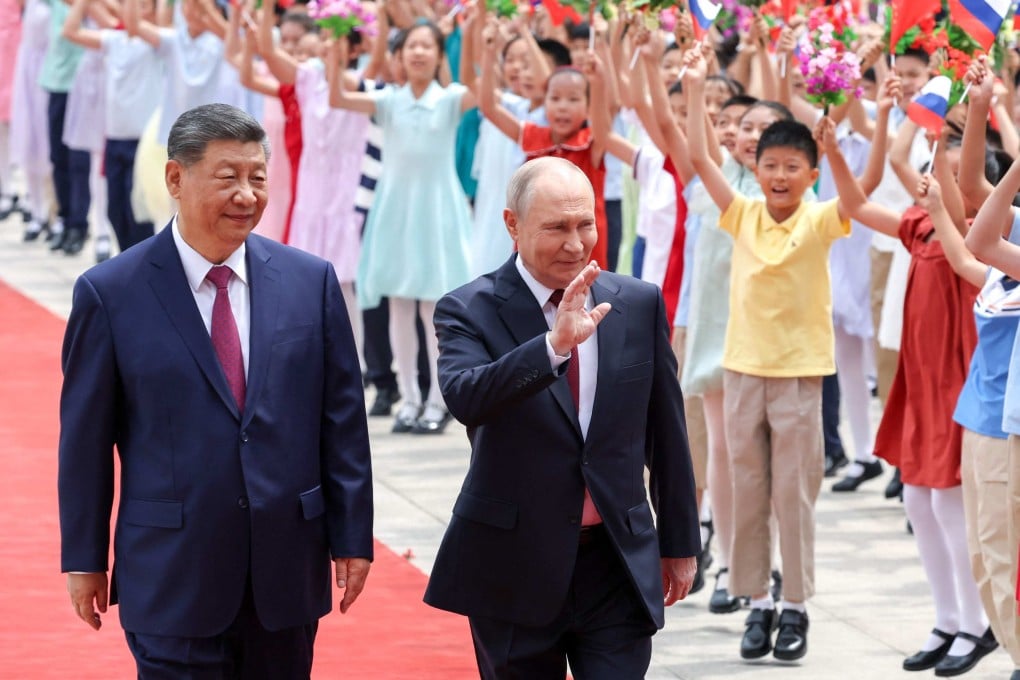 Russian President Vladimir Putin and Chinese leader Xi Jinping attend a welcome ceremony in Beijing on Wednesday. Putin is visiting China just days after US President Donald Trump travelled to Beijing. Photo: AFP