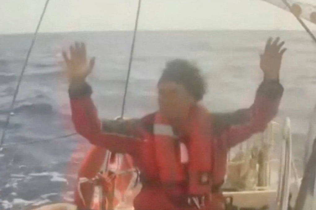 A person raises his hands as an Israeli naval boat intercepts the Global Sumud Flotilla en route to Gaza on Monday. Photo: Global Sumud Flotilla via Reuters