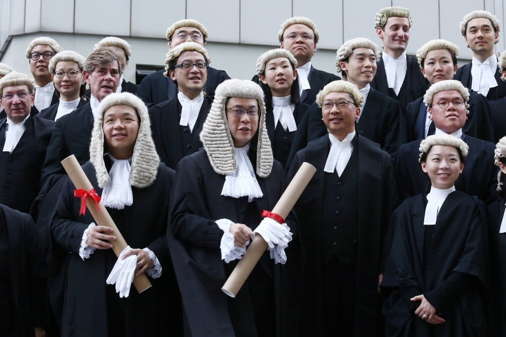 (Front row left to right) Bernard Man, Victor Dawes, Secretary for Justice Rimsky Yuen and other guests attend the ceremony for the admission of the new senior counsel. Photo: Jonathan Wong