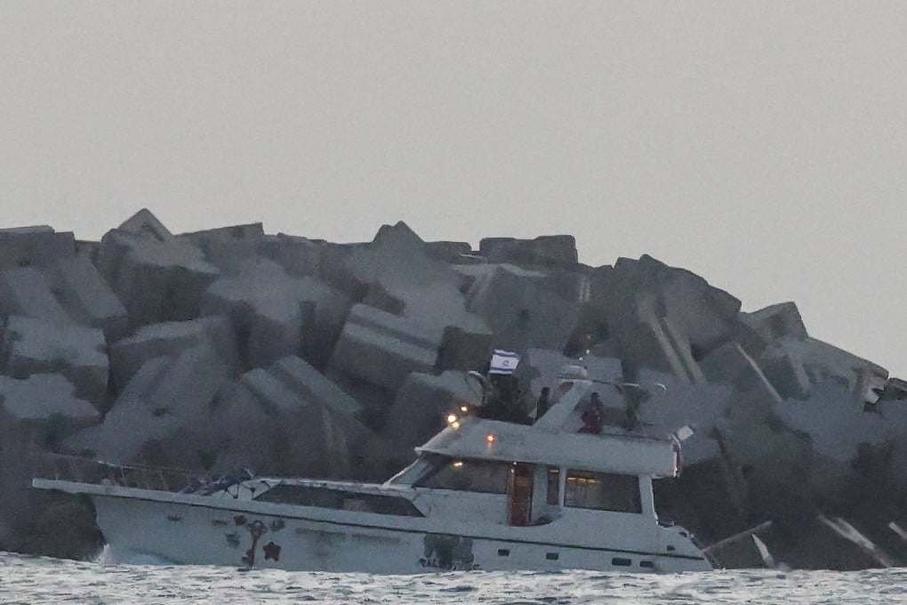 A boat bearing symbols of one of the vessels belonging to the Gaza-bound aid flotilla and intercepted by the Israeli navy, is motored towards the Israeli port of Ashdod. Photo: AFP