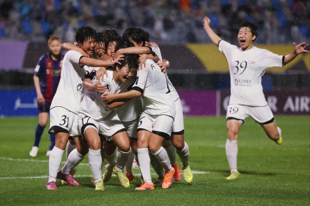 Naegohyang FC’s Kim Kyong-yong is mobbed by her teammates after scoring their second goal in the 2-1 win. Photo: Reuters
