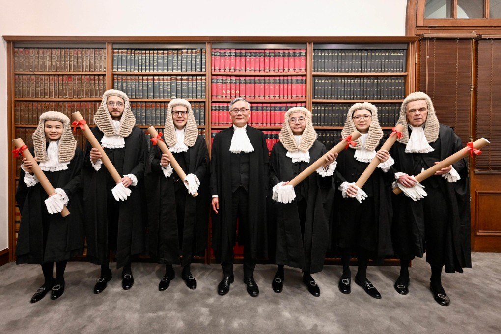 Chief Justice Andrew Cheung (centre) poses with six newly appointed senior counsel on May 16. Photo: Handout