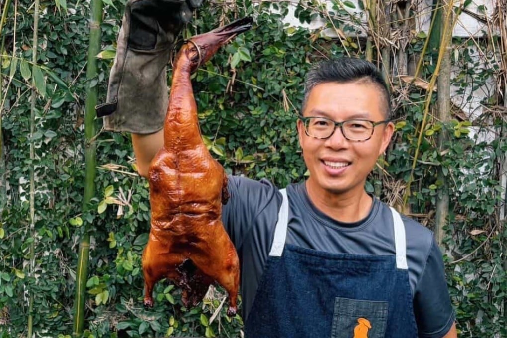 Vietnamese-American radiologist and cooking enthusiast Hong Pham pulls a Peking duck from the roaster in his back garden in Los Angeles. Photo: The Theodors Photography