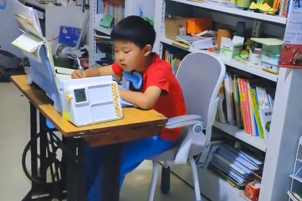 A mother in China has improved her son’s focus while he is doing homework by having him peddle a sewing machine as he works. Photo: Web