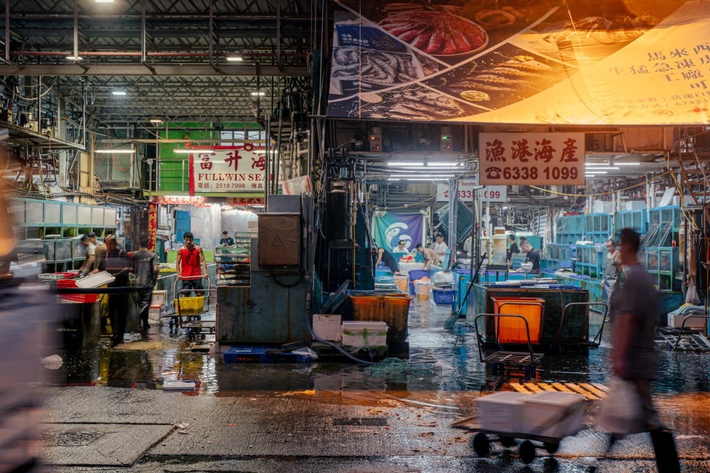 At 5am, it’s still dark at the Aberdeen Wholesale Fish Market, as fishermen and workers go about offloading the morning’s catch. Photo: Alexander Mak