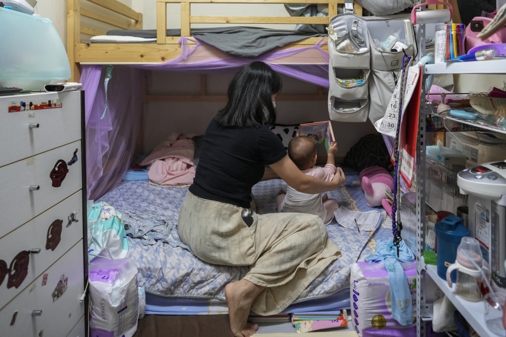 A woman tends to her daughter in their subdivided flat in Sham Shui Po on September 16, 2025. Photo: Sam Tsang