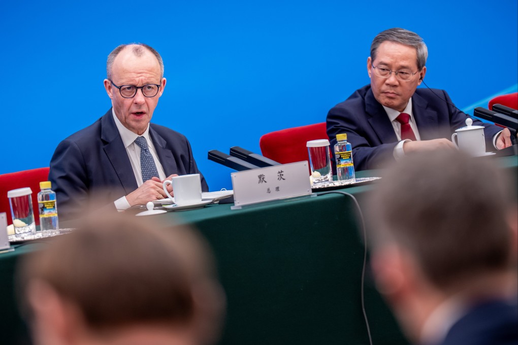 German Chancellor Friedrich Merz attends a meeting of the German-Chinese Business Advisory Committee with Premier Li Qiang at the Great Hall of the People in Beijing on February 25. Photo: EPA
