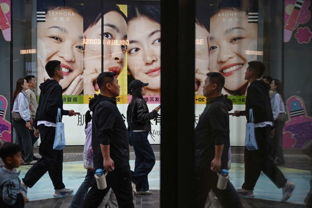 People are seen at a shopping mall in Beijing on May 2. Photo: AFP
