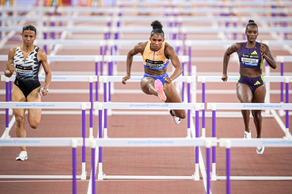 Masai Russell (centre), here competing in Zhejiang Province in May, is hoping to break the 100m hurdles world record in Saturday’s Xiamen Diamond League event. Photo: Xinhua