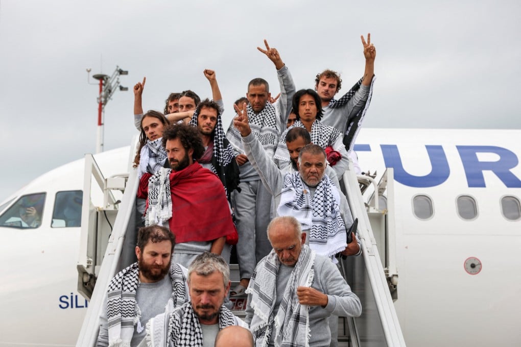 Activists disembark from a plane upon arrival at Istanbul Airport. Photo: Reuters