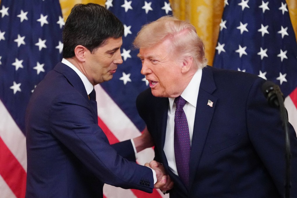 US President Donald Trump shakes hands with new Federal Reserve Chair Kevin Warsh (left) at the White House on Friday. Photo: AFP