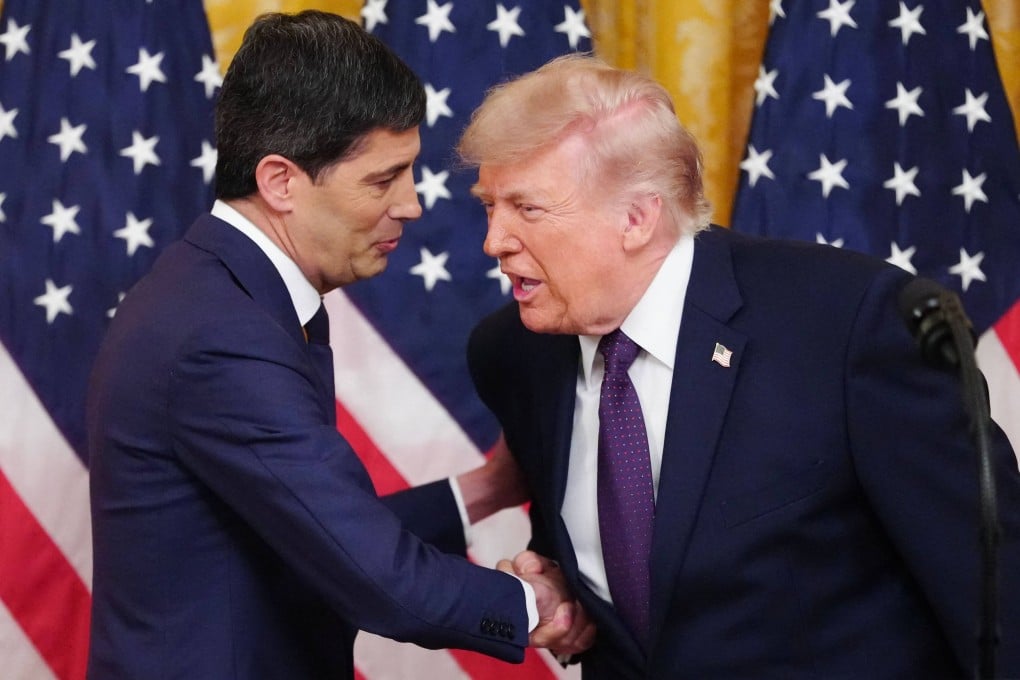 US President Donald Trump shakes hands with new Federal Reserve Chair Kevin Warsh (left) at the White House on Friday. Photo: AFP