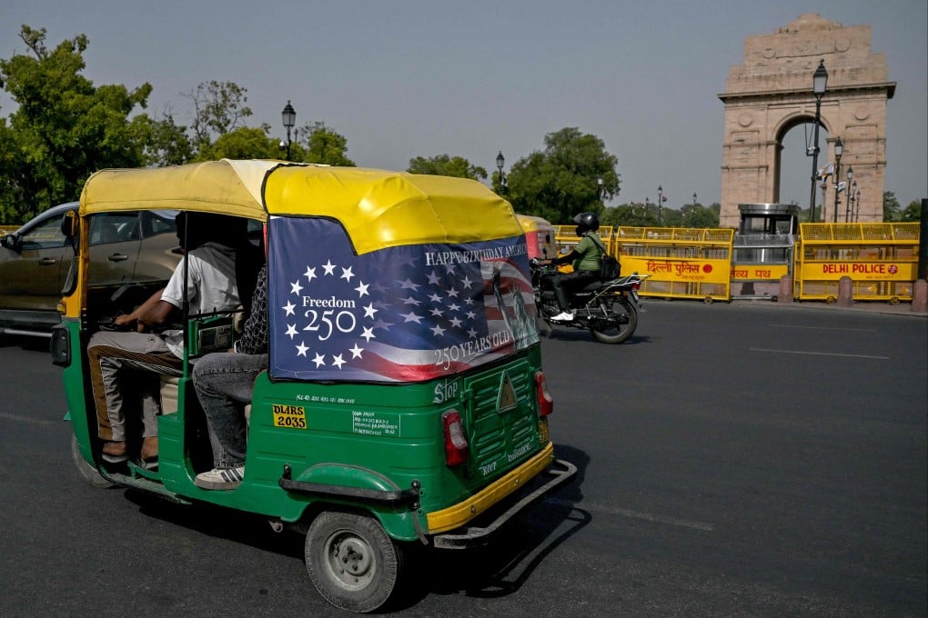 An auto-rickshaw drives along in New Delhi on Thursday, two days before fuel prices rose again. Photo: AFP