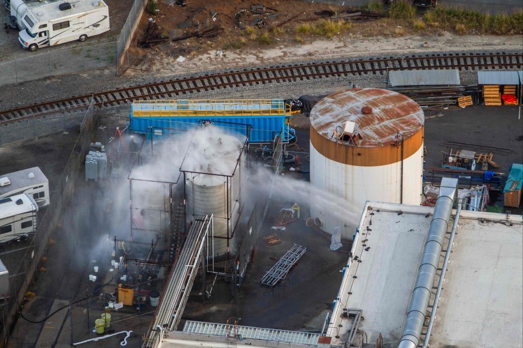 An aerial view of water being sprayed onto an overheated chemical tank in Garden Grove, California, on Saturday. Photo: Getty Images via AFP
