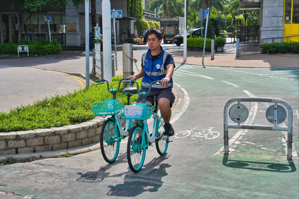 A worker collects shared bikes in Tseung Kwan O on May 8. Photo: Elson Li
