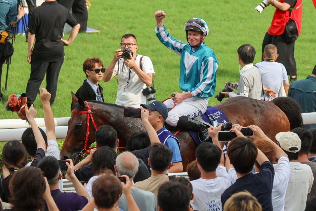 Jockey James McDonald salutes the crowd after guiding Romantic Warrior to victory in the Champions & Chater Cup. Photo: Dickson Lee