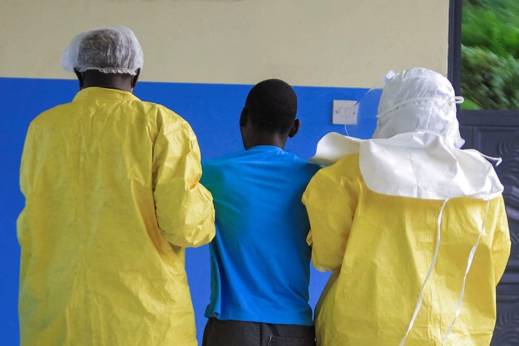 Congolese health workers receive a patient at a hospital on Thursday as authorities try to contain an Ebola outbreak in Rwampara, outside Bunia. Photo: Reuters