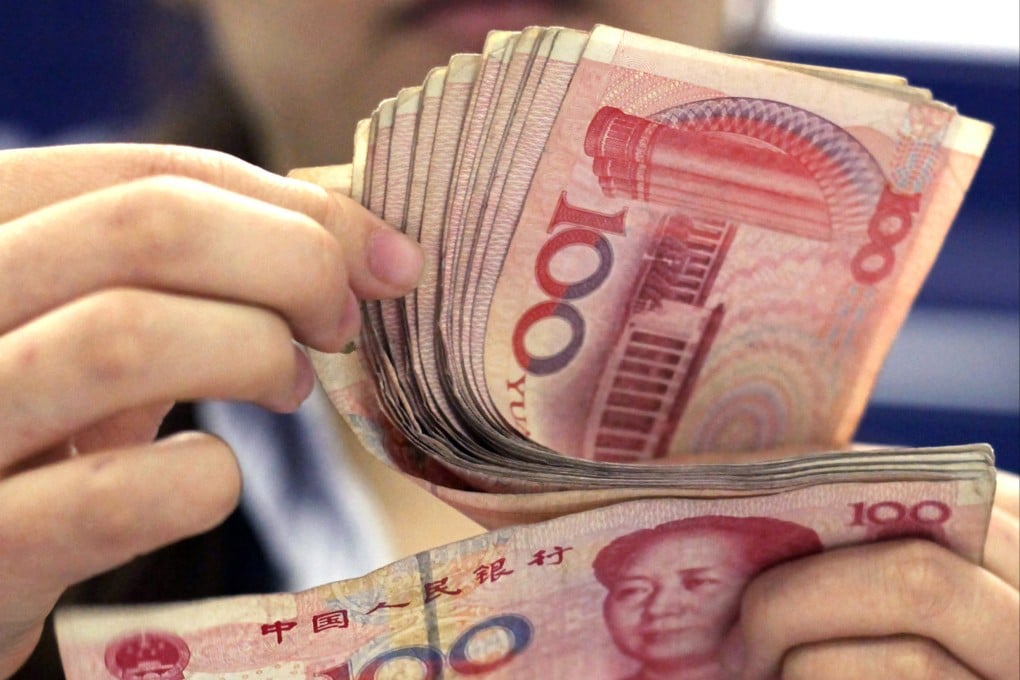 A former Chinese central bank official says wider international use of the yuan would not only benefit China’s economy but also contribute to the stability of the global financial system. Photo: AP