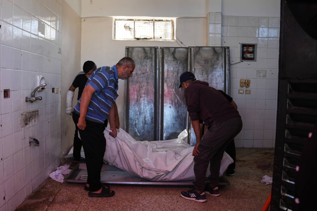 Palestinians carry the bodies of members of the Abu Malouh family during their funeral at Al-Aqsa Martyrs Hospital in Deir al-Balah, central Gaza on Sunday. Photo: AP