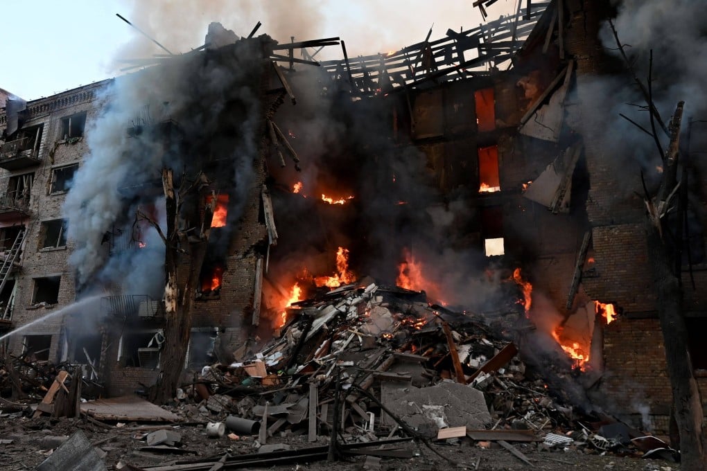 Firefighters work at the scene of a fire in a destroyed block of flats following a Russian missile attack in Kyiv, Ukraine on Sunday. Photo: SOPA Images via ZUMA Press Wire / dpa
