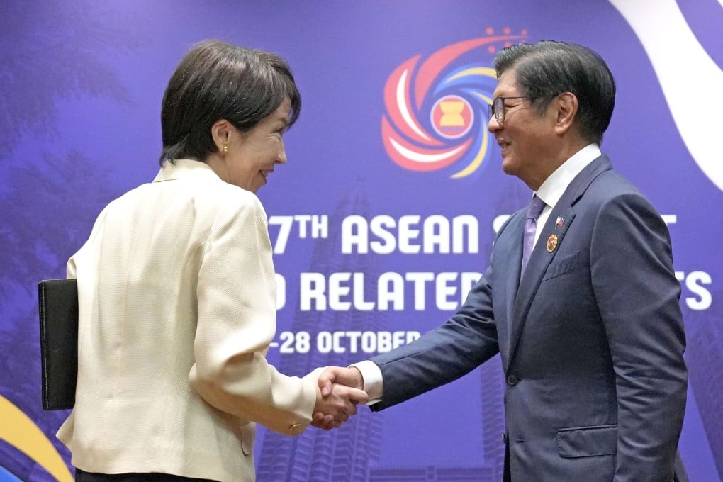Japanese Prime Minister Sanae Takaichi (left) shakes hands with Philippine President Ferdinand Marcos Jnr ahead of their talks in Kuala Lumpur in October last year. Photo: Kyodo