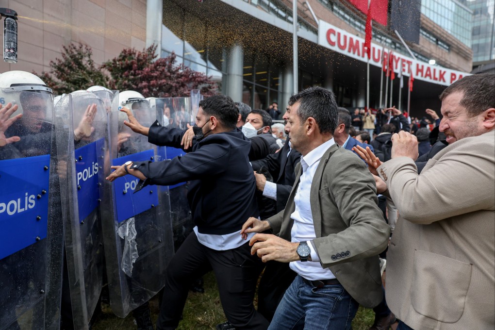 Police officers storm Turkey’s main opposition Republican People’s Party (CHP) headquarters to evict supporters gathered inside for party leader Ozgur Ozel, in Ankara on Sunday. Photo: Dia Photo via AP